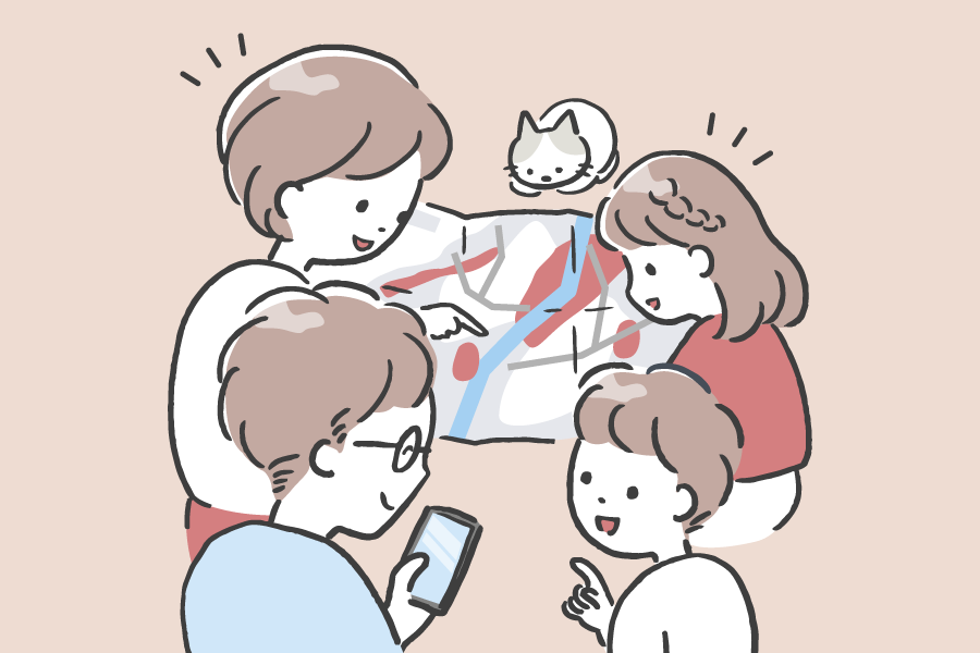 地図を囲み、話し合いをする家族